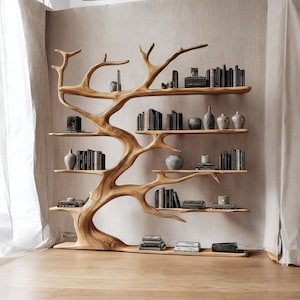 May include: A unique wooden bookshelf in the shape of a tree. The natural wood-toned shelf has multiple branches that serve as shelves, displaying books and decorative items. The design adds a touch of nature to interior decor.