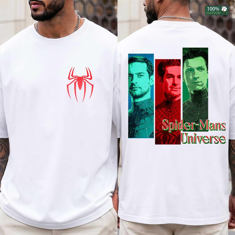 May include: A white short-sleeve t-shirt featuring a red spider logo on the front chest. The back displays three vertical rectangular panels showing portraits of three different Spider-Man actors in teal, red, and green, with the text Spider-Mans Universe.