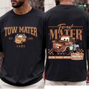 May include: A black t-shirt featuring a graphic of the character Tow Mater. The front displays the text Tow Mater Est. 2006 Cars. The back shows a larger illustration of the character with the text Tow Mater Anytime Anywhere Anyplace.