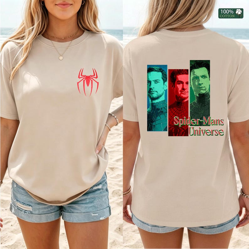 May include: A beige short-sleeve t-shirt featuring a small red spider logo on the front chest. The back displays three rectangular portraits of different characters with the text Spider-Mans Universe. A 100% cotton label is visible in the corner.