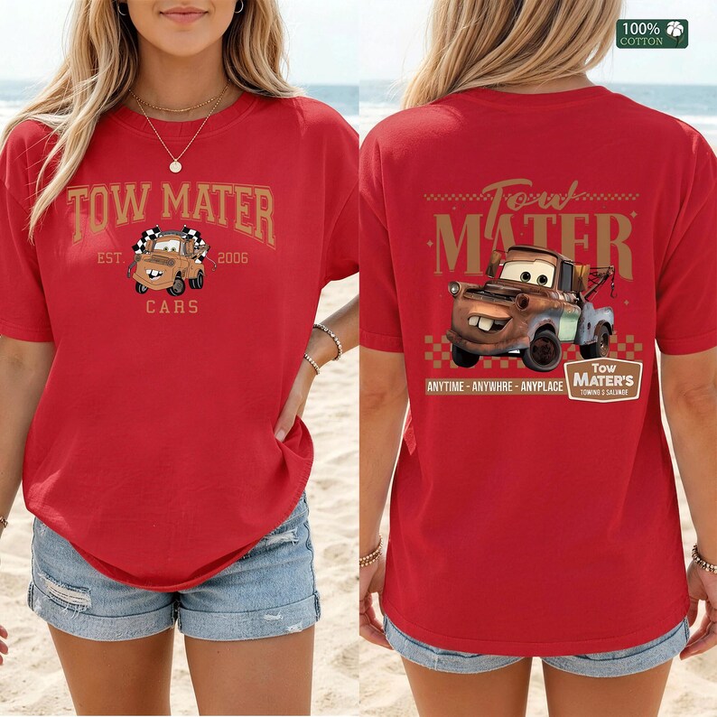 May include: A red short-sleeve t-shirt featuring a graphic of the character Tow Mater from the movie Cars. The front displays the text Tow Mater Est. 2006. The back features a larger graphic of the truck with the text Tow Mater Anytime Anywhere Anyplace.