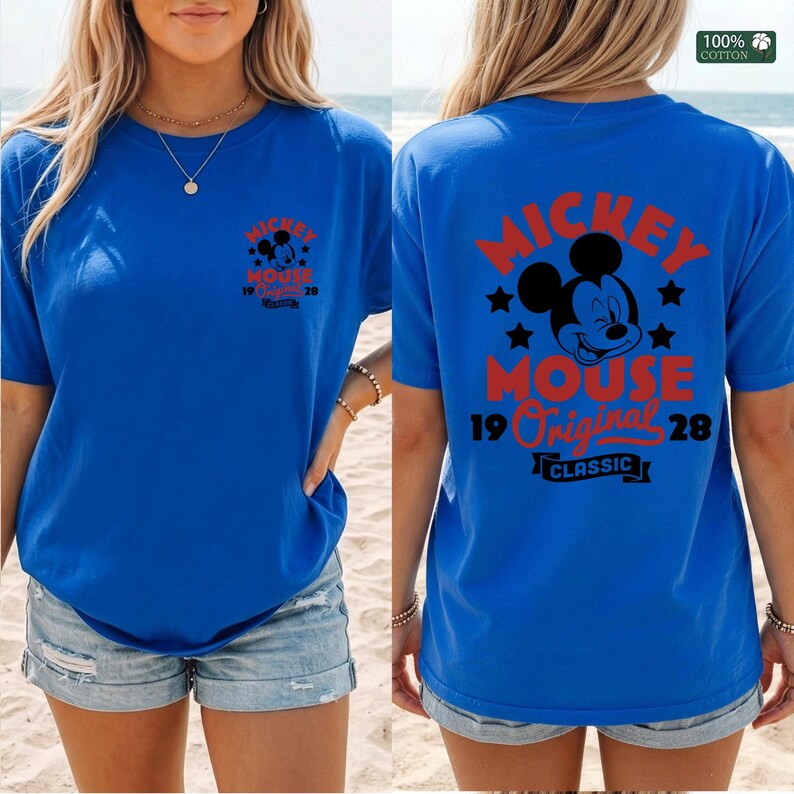 May include: Blue t-shirt featuring Mickey Mouse graphics. The front displays a small Mickey Mouse design with text, while the back showcases a larger Mickey Mouse graphic with the words "Mickey Mouse Original Classic 1928". Made of 100% cotton.