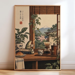 May include: A framed art print depicting a frog sitting on books by a window, holding a cup. The scene includes a coffee dripper, a grinder, a croissant, and a view of a mountain. Japanese text reads "コーヒーのある穏やかな朝".