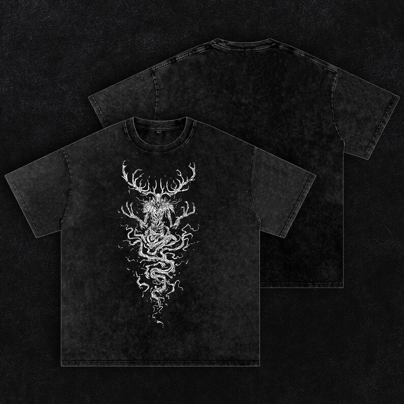 May include: A black acid-wash t-shirt featuring a white graphic print of a skeletal, antlered creature with long, spindly fingers and a swirling, root-like lower body. The design is centered on the chest, while the back of the shirt is plain.