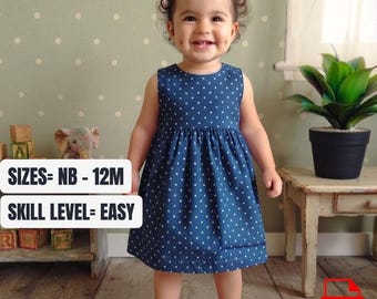 May include: A sleeveless navy blue dress with a white polka dot pattern. The dress features a round neckline and a gathered skirt. Text on the image reads: SIZES= NB - 12M and SKILL LEVEL= EASY. A red PDF icon is visible in the bottom right corner.
