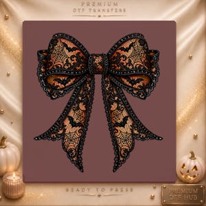 May include: A decorative bow featuring a black lace overlay with a spiderweb and bat pattern over an orange base. The bow has a central knot and two long, flowing tails with scalloped edges. The text Premium DTF Transfers Ready to Press is visible.