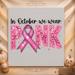 May include: A square DTF transfer sheet featuring the black text In October we wear and the word PINK in large, glittery pink letters. A pink awareness ribbon replaces the letter I in PINK, surrounded by small pink star accents on a light gray background.