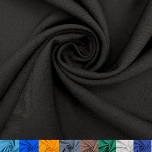 May include: A solid black fabric with a fine, uniform weave texture. The material is gathered into a central spiral, creating deep, flowing folds and shadows that highlight the matte finish and consistent dark colour of the textile surface.