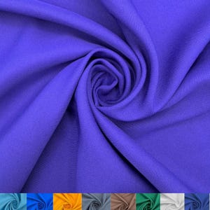May include: A vibrant royal purple fabric featuring a fine, uniform weave texture. The material is arranged in a swirling, gathered pattern that creates deep, soft folds and shadows, highlighting the consistent color and smooth surface finish.
