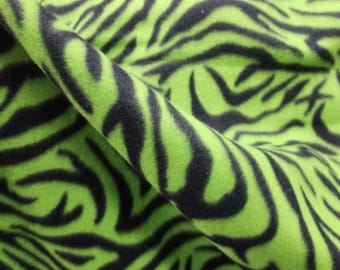 LIME/NERO - Stampa zebrata - Materiale in pile morbido e anti-pilling, venduto tagliato su misura.