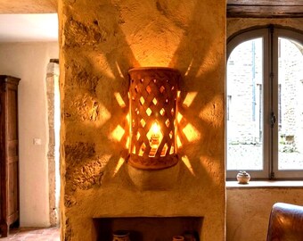 Natural  terracotta lamp allowing candlelight to glow beautiful