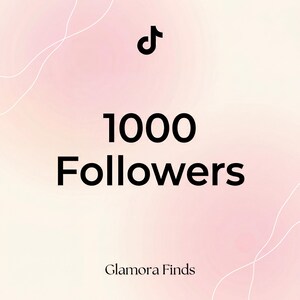 May include: A digital graphic with a TikTok logo and the text "1000 Followers" in bold black font. The background is a gradient of pink and white with subtle curved lines. The text "Glamora Finds" is at the bottom.