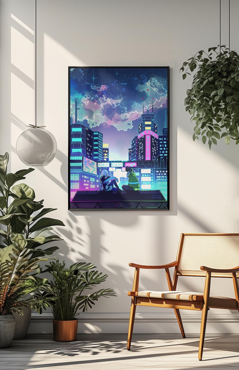 May include: Framed art print showing an anime-style cityscape at night. The image features two figures on a rooftop, with a colourful sky and neon-lit buildings. The print is displayed on a white wall, with plants and a wooden chair in the foreground.