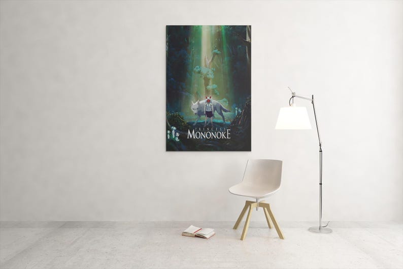 May include: A framed art print of a scene from the animated film "Princess Mononoke." The artwork depicts a figure with a wolf in a forest setting, with the film's title at the bottom. The print is displayed on a white wall.
