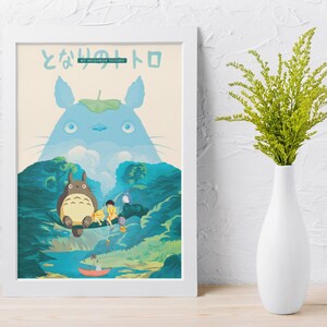 May include: A framed art print featuring characters from the animated film, "My Neighbor Totoro." The artwork depicts Totoro, a large forest spirit, with other characters in a vibrant forest scene. The print is in a white frame.