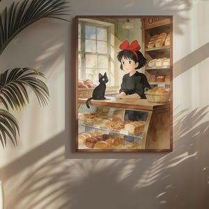 May include: Watercolor print of a bakery scene featuring a young woman with a red bow, a black cat, and various baked goods. The print is framed and hanging on a wall, with a potted plant in the foreground.