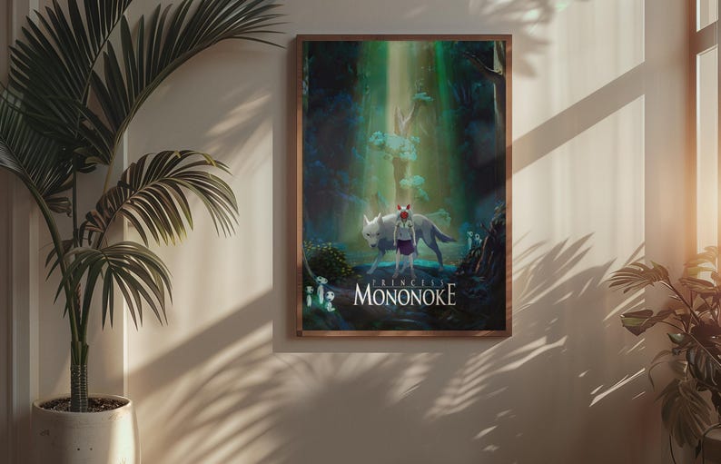 May include: Framed art print featuring a scene from Princess Mononoke. The artwork depicts a girl and a wolf in a forest setting, with the title "PRINCESS MONONOKE" at the bottom. The print is in a wooden frame.