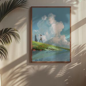May include: A framed art print depicts a serene landscape with two figures on a grassy hill, overlooking a body of water. The sky is filled with fluffy white clouds. The artwork is in a wooden frame, displayed on a neutral-colored wall.