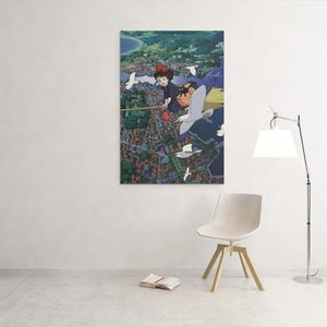 May include: A framed art print featuring an anime-style illustration of a girl with red hair flying over a town with seagulls. The artwork has a vibrant color palette and a detailed cityscape.