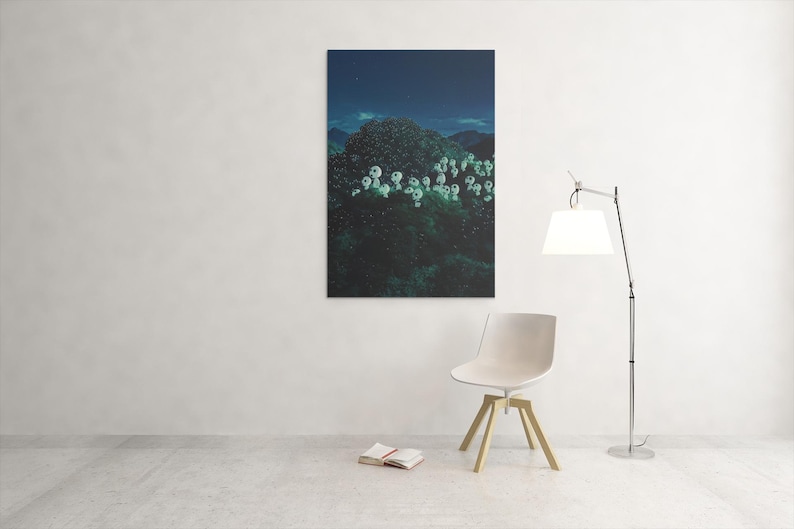 May include: A framed canvas art print depicting a dark, lush landscape with white, glowing floral shapes under a starry night sky. A modern white chair with wooden legs, a floor lamp, and an open book are in the foreground.