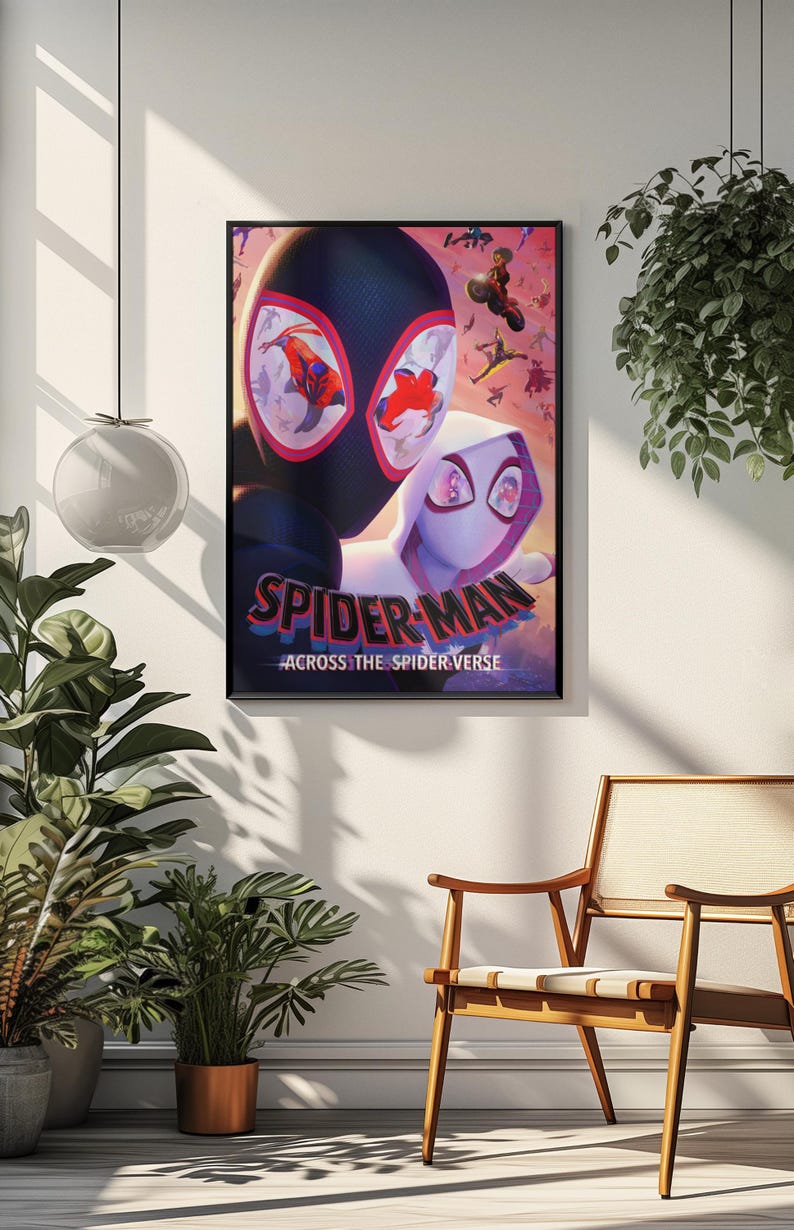 May include: A framed poster featuring Spider-Man characters from the movie "Across the Spider-Verse." The poster showcases Spider-Man in a black suit and Spider-Gwen in a white suit, with a vibrant background of other Spider-Man characters.