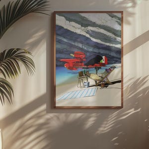 Peut inclure: Une impression d'art encadr&eacute;e repr&eacute;sente un avion rouge sur une plage avec une personne se relaxant dans une chaise. L'&oelig;uvre d'art pr&eacute;sente une serviette &agrave; rayures bleues et blanches, une petite table et un fond de ciel nuageux. Le cadre est de couleur marron chaud.