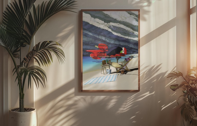 Peut inclure: Une impression d'art encadr&eacute;e repr&eacute;sente un avion rouge sur une plage avec une personne se relaxant dans une chaise. L'&oelig;uvre d'art pr&eacute;sente une serviette &agrave; rayures bleues et blanches, une petite table et un fond de ciel nuageux. Le cadre est de couleur marron chaud.