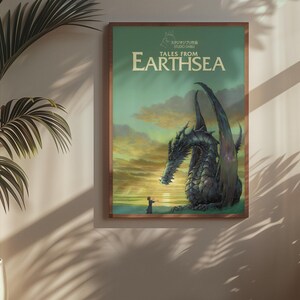 May include: A framed poster featuring a dragon from the book "Tales from Earthsea." The artwork depicts a large, dark dragon with a person standing before it, set against a sunset sky. The poster is in a wooden frame.