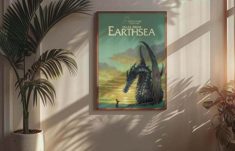 May include: A framed poster featuring a dragon from the book "Tales from Earthsea." The artwork depicts a large, dark dragon with a person standing before it, set against a sunset sky. The poster is in a wooden frame.