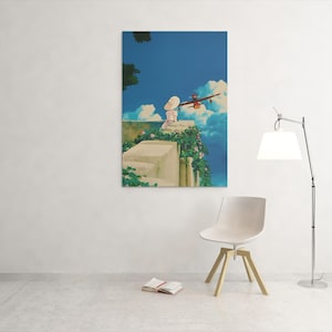 May include: A framed art print depicts a scene with a person in a white dress and hat, overlooking a blue sky with clouds and a red airplane. The artwork is mounted on a white wall, with a chair and lamp in the foreground.