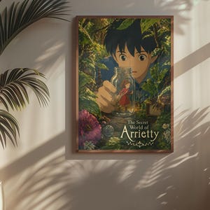 May include: A framed poster of the animated film "The Secret World of Arrietty." The artwork depicts a young boy peering at a tiny girl inside a glass jar, set against a lush, green forest backdrop. The poster is in a wooden frame.