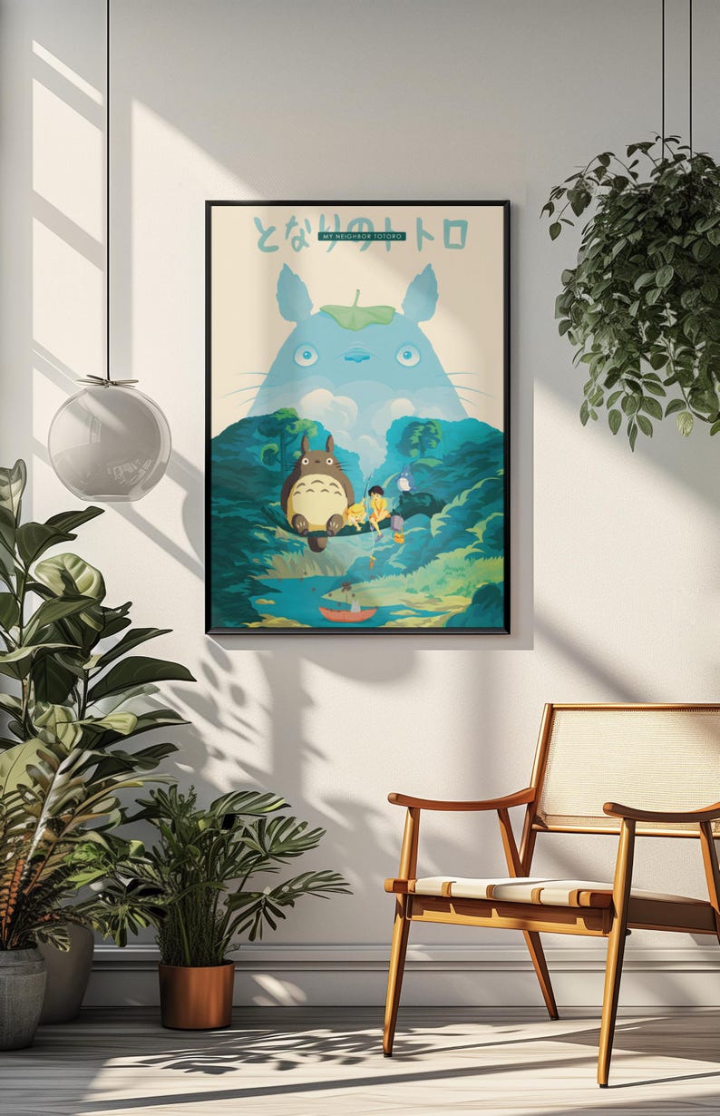 May include: A framed poster featuring a scene from "My Neighbor Totoro." The artwork depicts Totoro, a large forest spirit, with other characters in a lush, green landscape. The title is written in Japanese characters at the top.