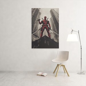 May include: A framed canvas print featuring a red superhero character holding two swords, standing on a rooftop with a cityscape backdrop. The artwork has a gritty, urban aesthetic.