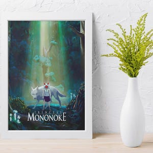 May include: A framed art print featuring a scene from "Princess Mononoke." The artwork depicts a white wolf, a figure in a purple dress, and forest elements. The title "Mononoke" is displayed at the bottom. A white vase with green foliage is on the right.