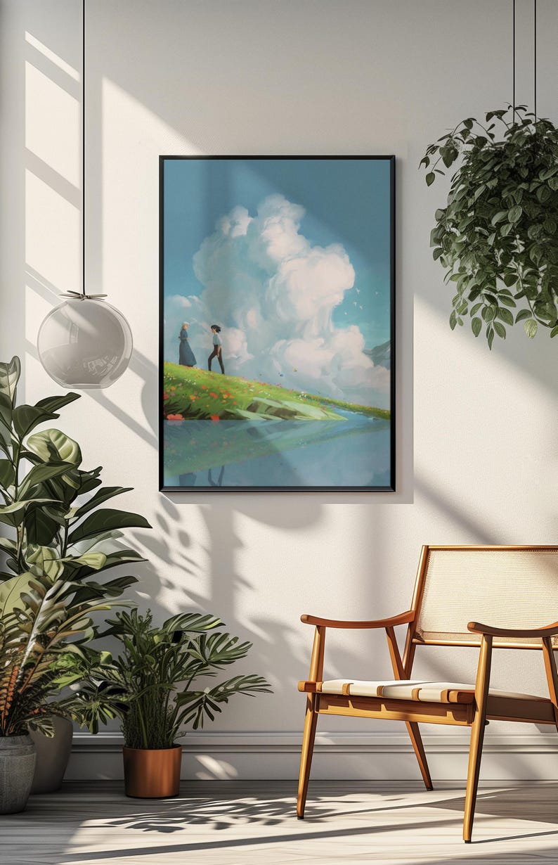 May include: Framed art print featuring a serene landscape with two figures on a grassy hill, overlooking a body of water. The artwork showcases a vibrant sky with large, fluffy clouds and a soft, natural color palette. The print is displayed in a black frame.
