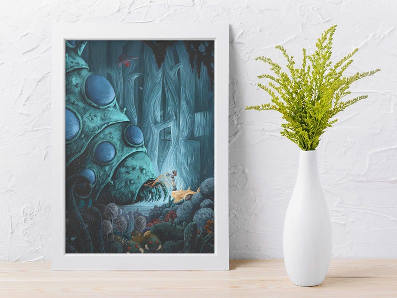 May include: A framed fantasy art print featuring a surreal landscape with a large, teal, bulbous structure and a small, golden creature. The artwork is set in a blue-toned environment. A white vase with green foliage sits to the right.