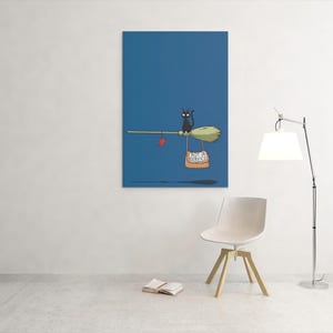 May include: A whimsical illustration on a blue background depicts a black cat riding a broom. The broom carries a bag with text and a red heart. The artwork is displayed on a wall, with a chair and lamp in the foreground.