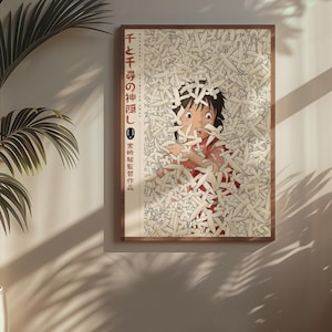 Puede incluir: P&oacute;ster enmarcado con un personaje de la pel&iacute;cula de animaci&oacute;n "El viaje de Chihiro". La obra de arte representa a una persona joven rodeada de objetos blancos con forma de papel. El p&oacute;ster est&aacute; en un marco de madera y cuelga de una pared.
