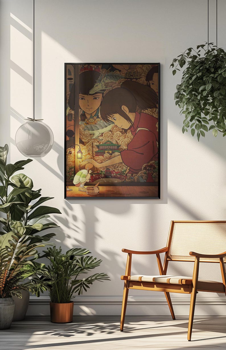 May include: Framed art print depicting a scene from an animated film. The artwork shows two figures in a room with a detailed, colourful background. The main figure is wearing a red garment. The print is in a black frame.