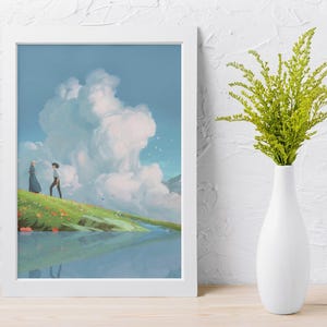 May include: A framed art print depicts a serene landscape with two figures on a grassy hill, overlooking a reflective body of water. The sky is filled with fluffy white clouds. A white vase holds green foliage.
