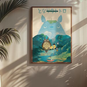 May include: A framed poster featuring a scene from the animated film "My Neighbor Totoro." The artwork depicts Totoro, a large forest spirit, with other characters in a lush, green landscape. The poster is in a wooden frame and is displayed on a wall.
