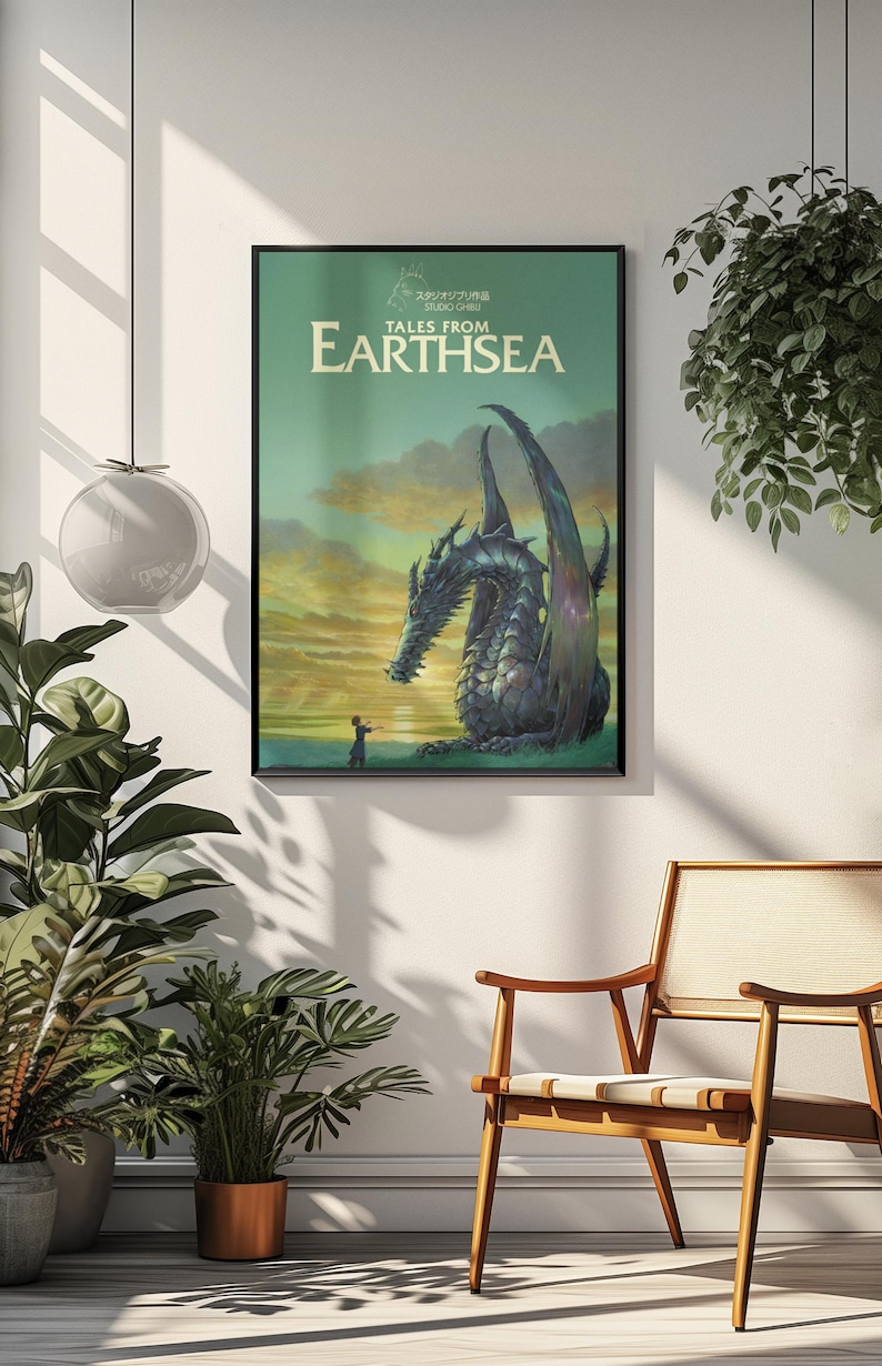 May include: Framed poster featuring a dragon from "Tales from Earthsea." The artwork depicts a large, detailed dragon with outstretched wings, facing a small figure. The poster has a green and yellow background with the title text.