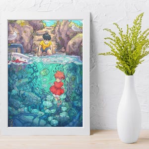 May include: A framed art print featuring a split scene of a boy on a rocky shore and a girl underwater with fish. The artwork has a vibrant color palette with blues, greens, and reds. A white vase with green stems is on the right.