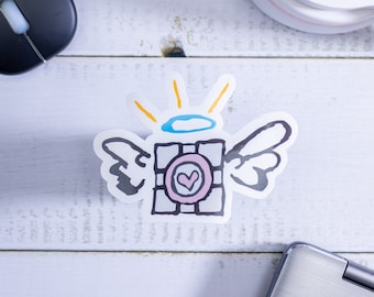 Winged Companion Cube Color Sticker. Indoor/Outdoor Sticker w/UV Laminate Protection.