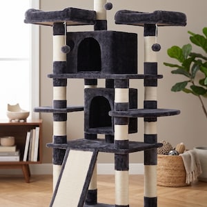 May include: A multi-level cat tree in shades of gray and cream. It features multiple platforms, a hideaway cubby, a ramp, and dangling toys. The posts are wrapped in cream-colored sisal rope, providing scratching surfaces for cats.