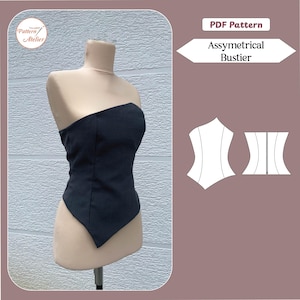 May include: A black asymmetrical bustier displayed on a mannequin. The strapless top has a pointed hemline and is made of a dark fabric. A PDF pattern with the text "Assymetrical Bustier" is also shown.