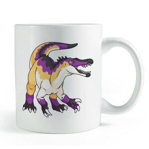 May include: White ceramic mug featuring a cartoon dinosaur with a purple, yellow, and black color scheme. The dinosaur has sharp teeth and claws. The mug has a curved handle and is suitable for hot or cold beverages.
