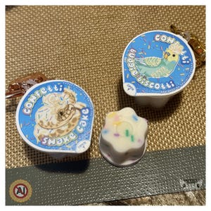Llavero antiestrés con forma de taza de pudín de confeti Full Set