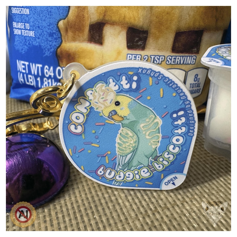 Llavero antiestrés con forma de taza de pudín de confeti Budgie Biscotti