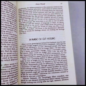 May include: Open book page with text about alexithymia and the phrase "In Praise of Gut Feeling." The page numbers are visible. The text is in black font on a white background.